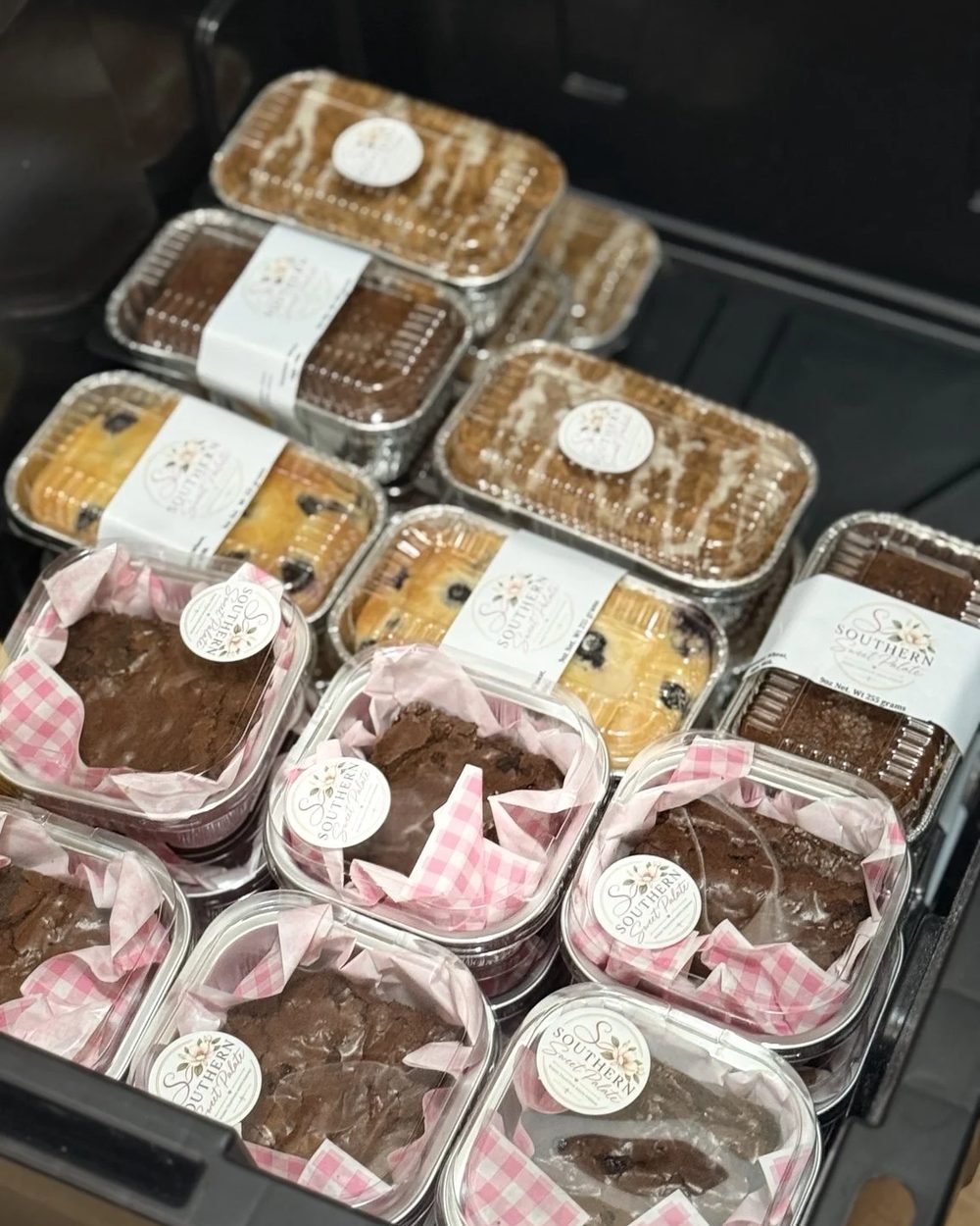 Packaged pound cake loaves and brownies ready for a market